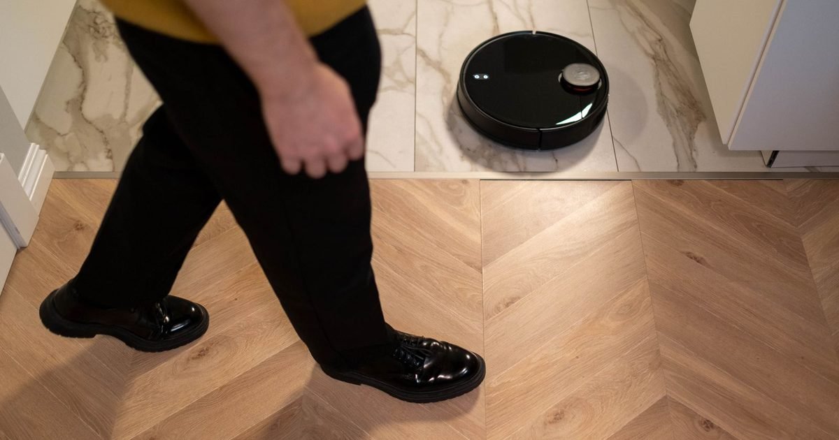 Robot vacuum cleaning a wood floor