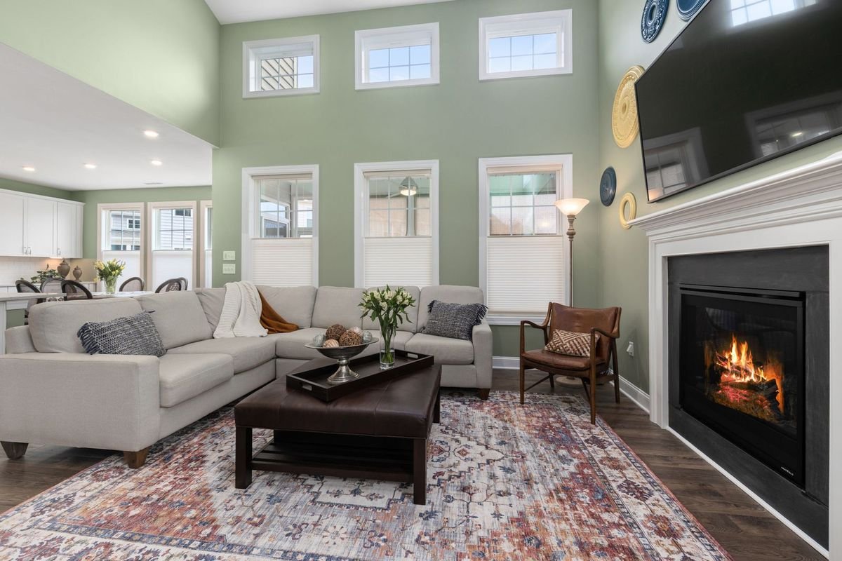 Bright living room with a fireplace under a wall-mounted TV (representative photo, not the exact product)