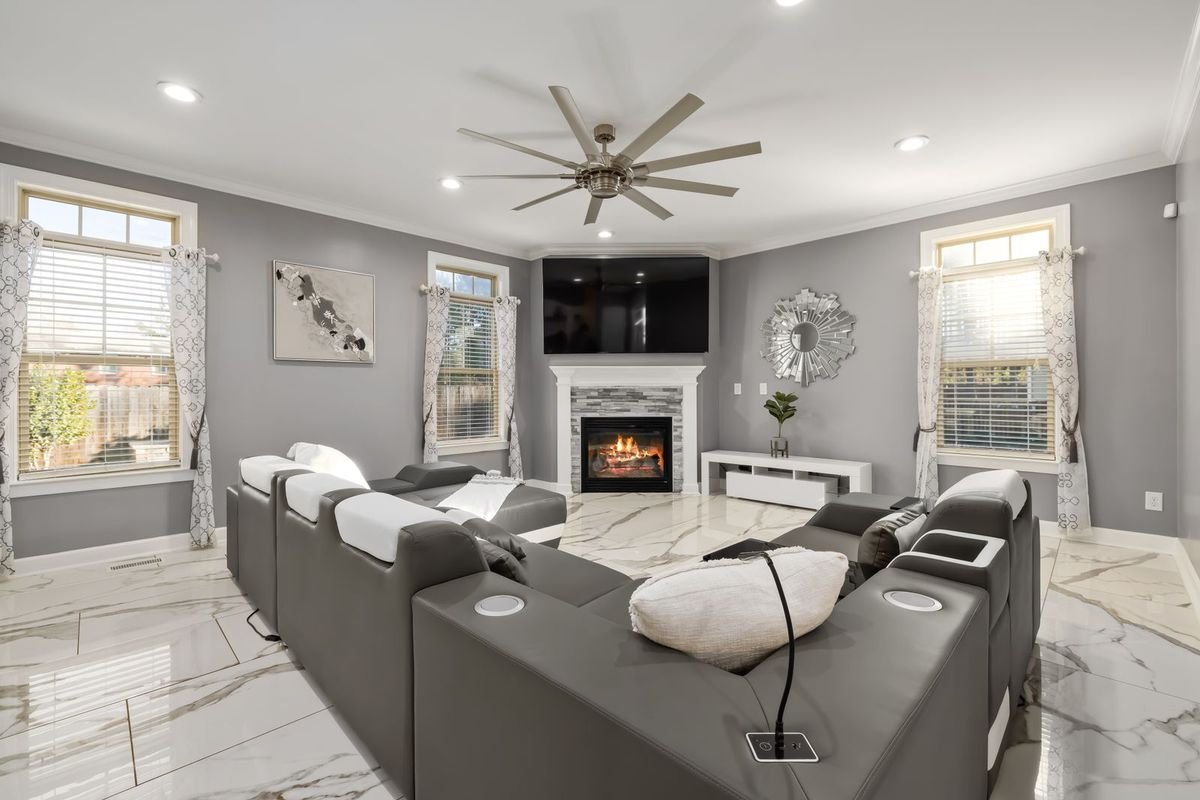 Contemporary living room with a built-in fireplace and gray sectional (representative photo, not the exact product)