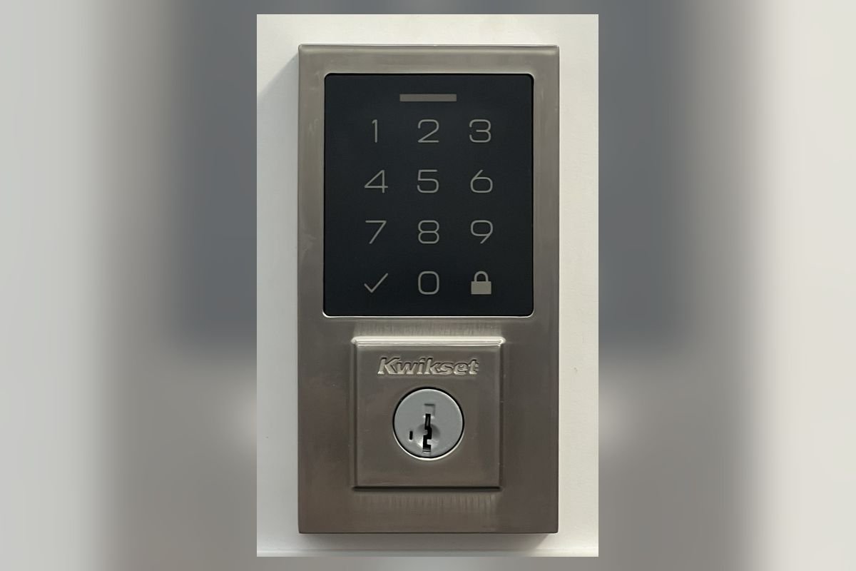 Satin nickel touchscreen keypad deadbolt on a door (representative photo, not the exact product)